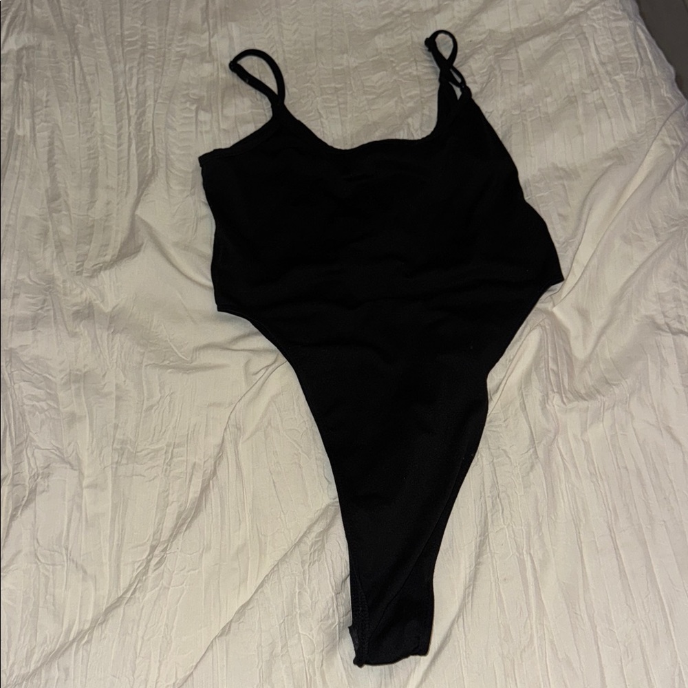 Worn Black bodysuit